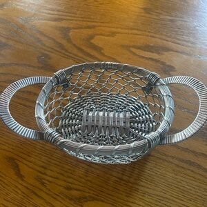 Non-magnetic silver-tone metal (likely nickel silver or silverplate)” basket